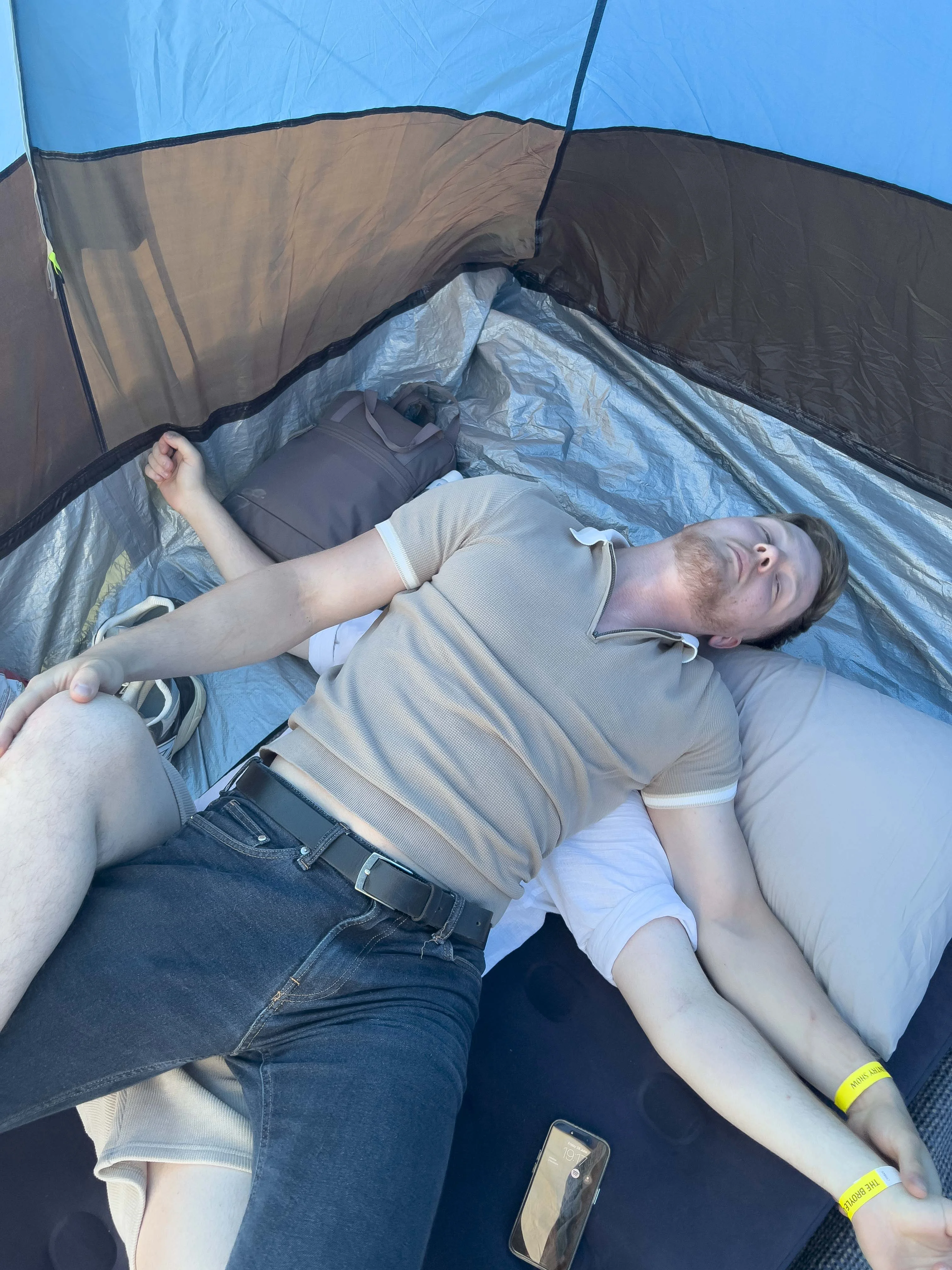 Blue laying on top of Toby in the tent
