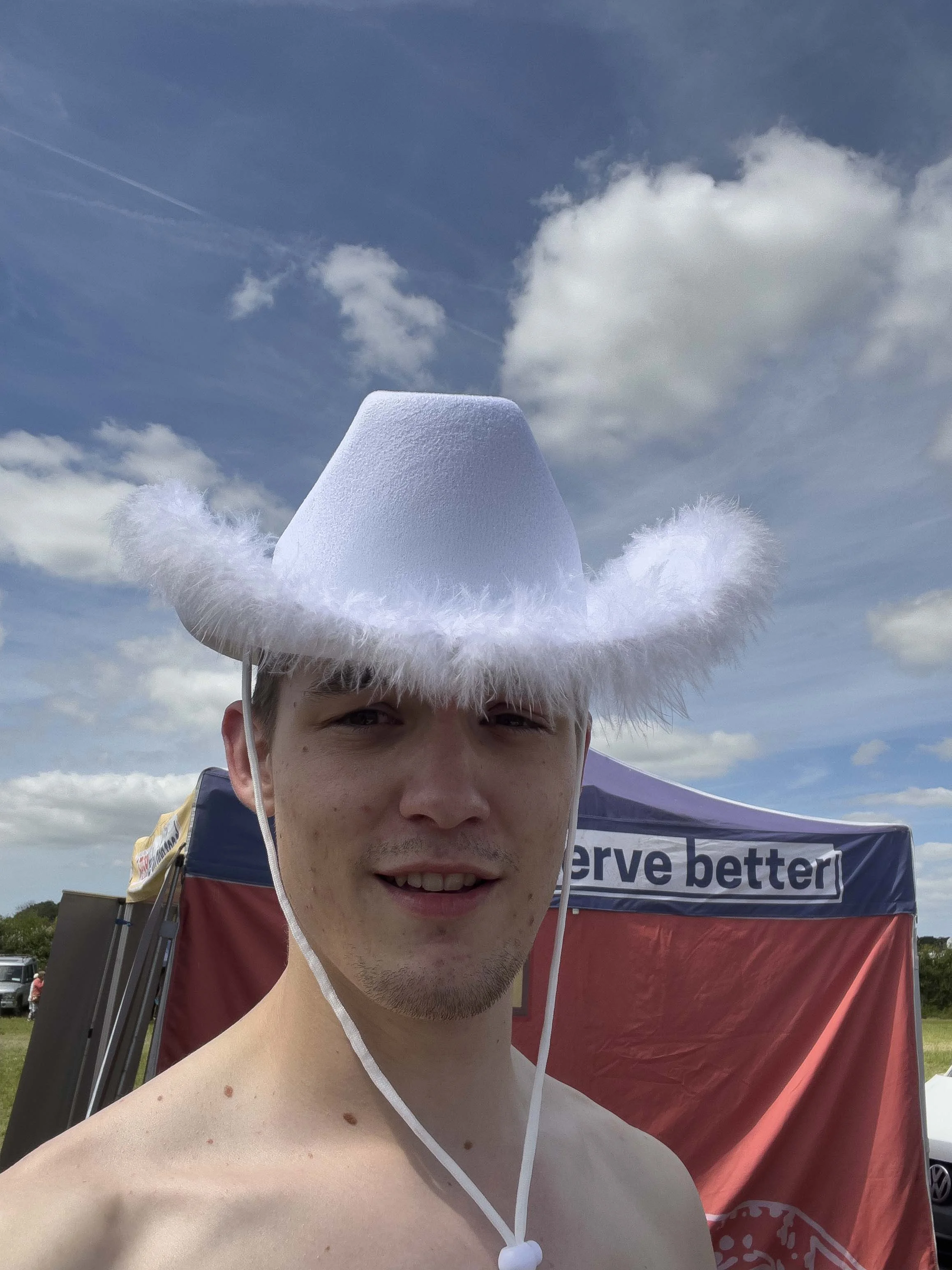 Ryan with a fluffy white cowboy hat