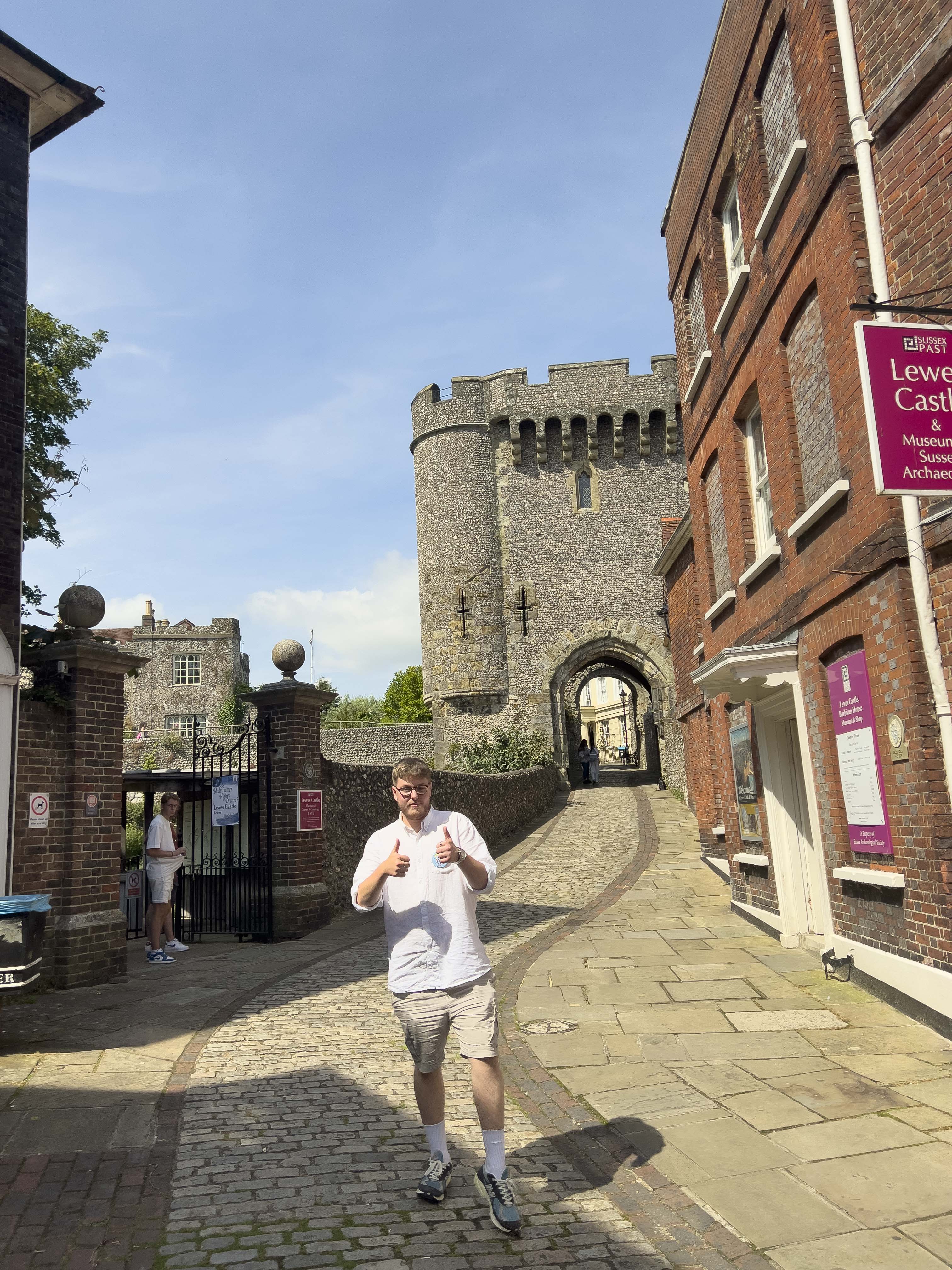 Toby with thumbs up outside the Lewes Castle