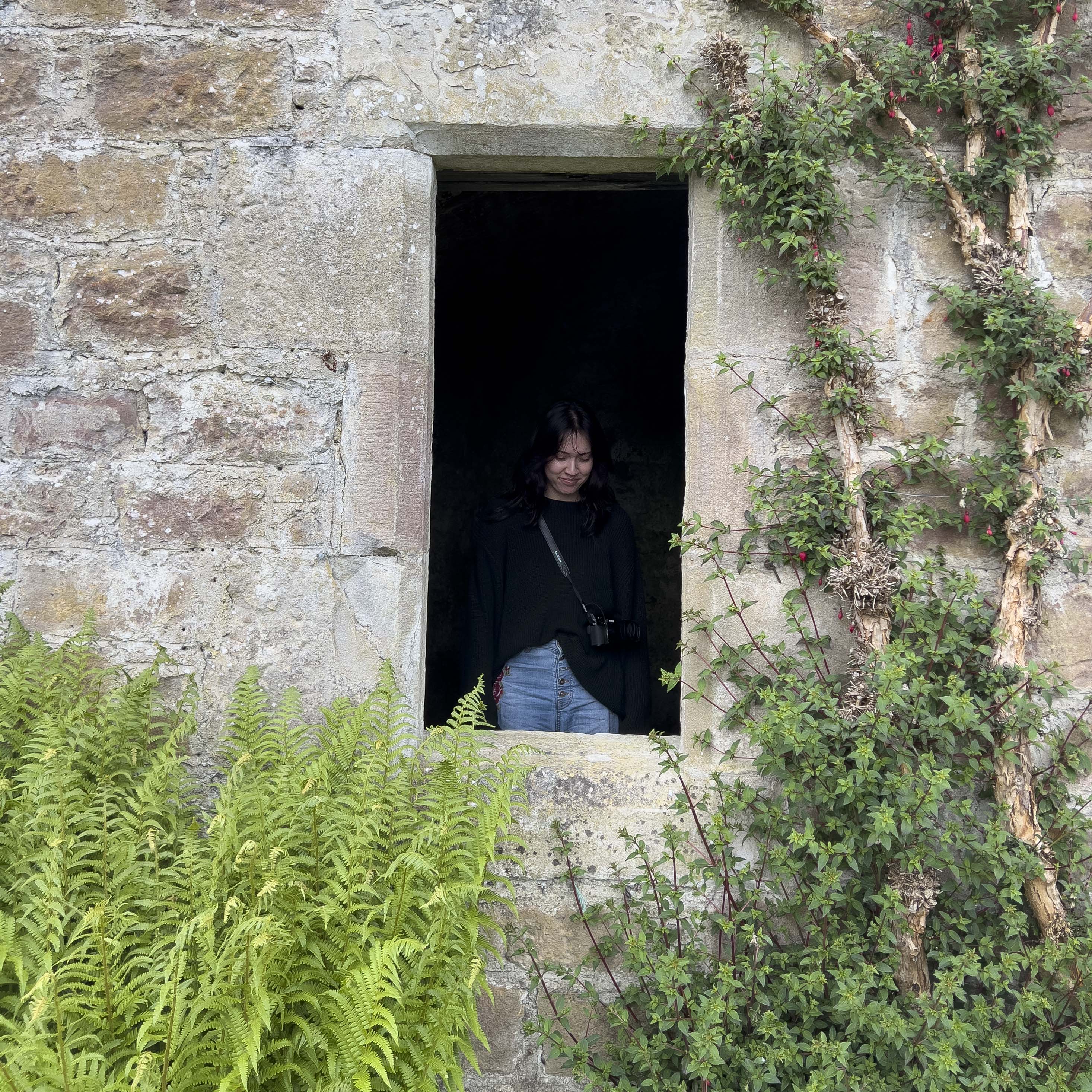 Talli standing in the window arch