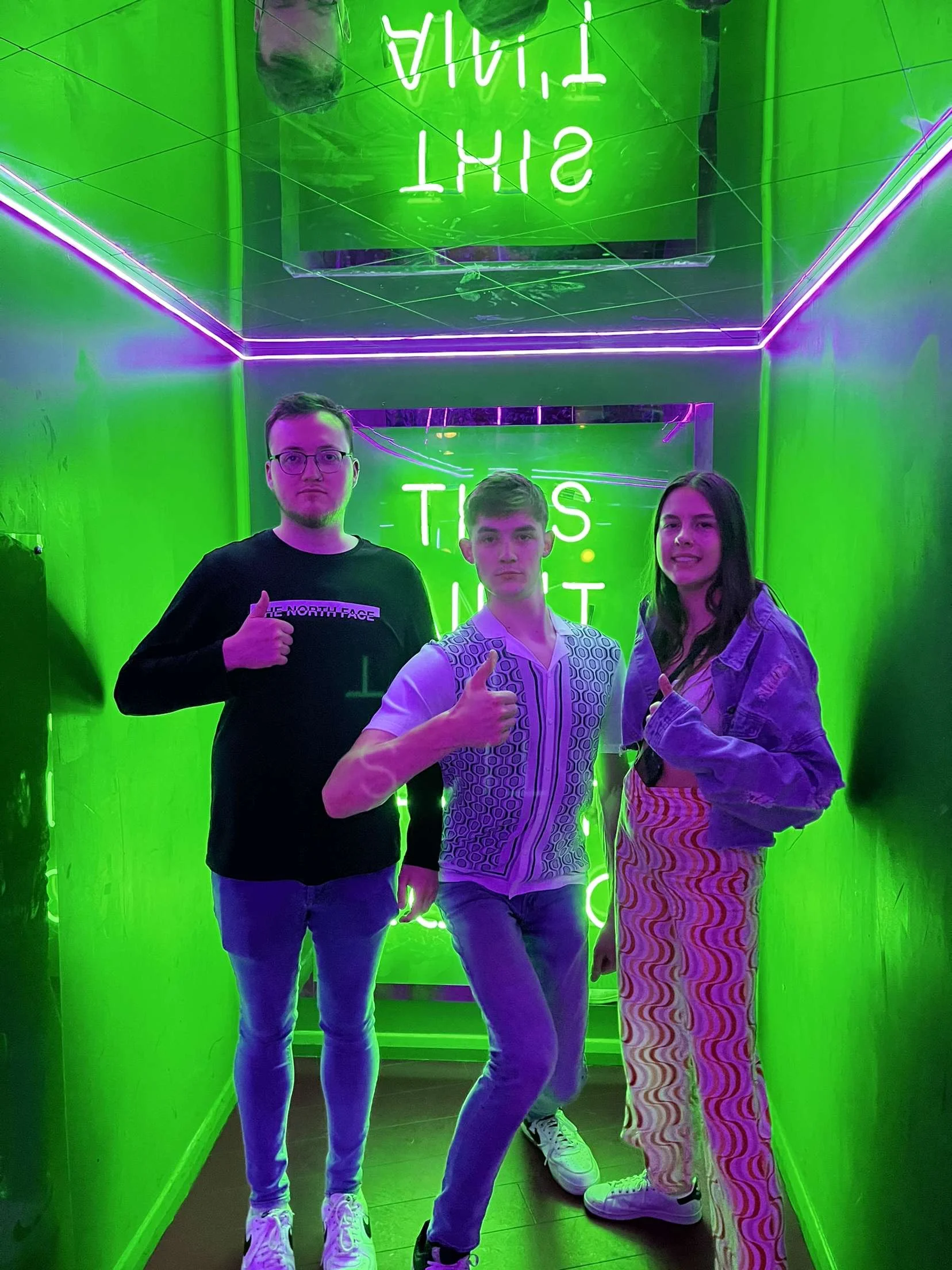 Dameon and ryan next to a large cookie character