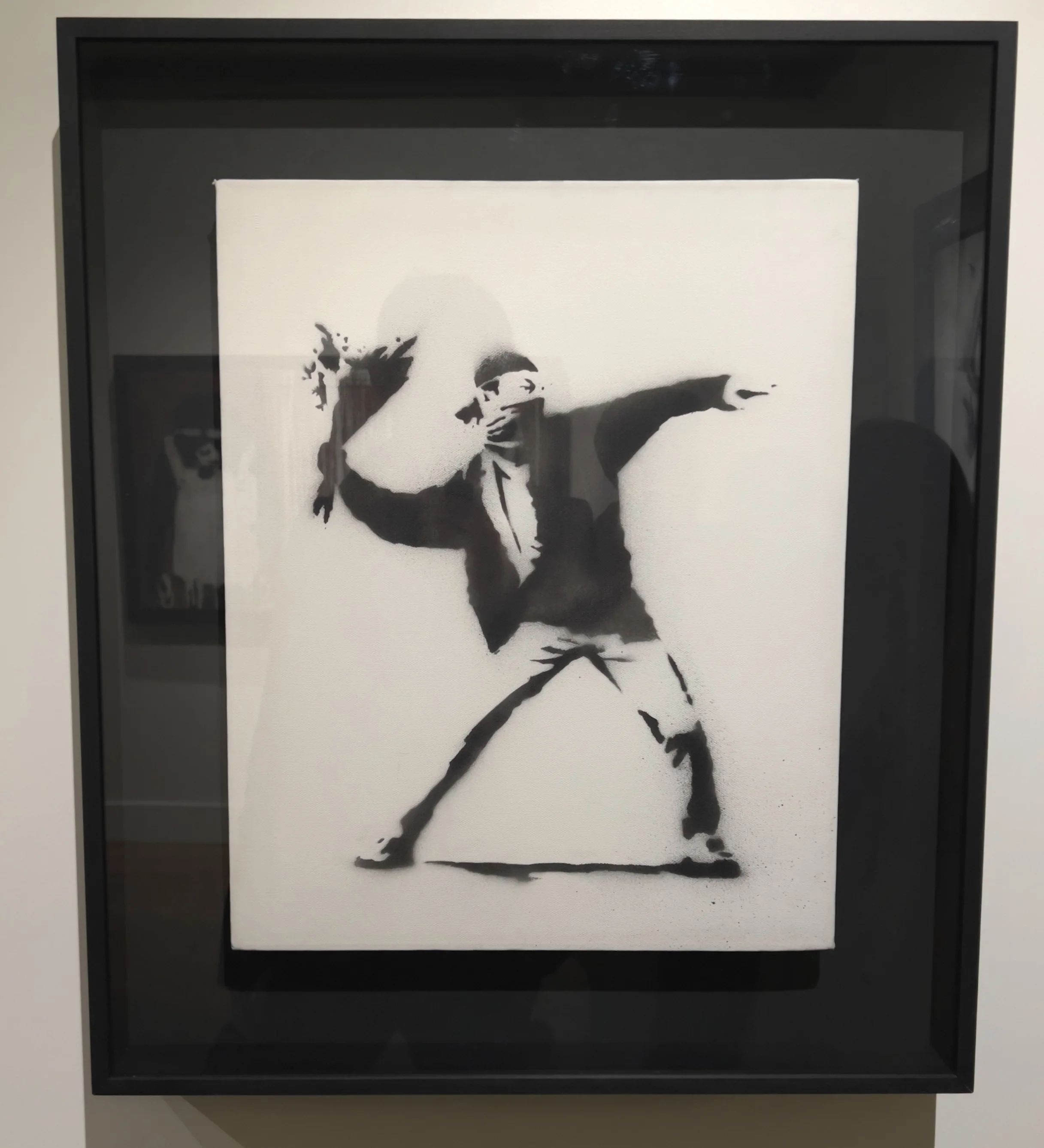 Banksy Flower Thrower style artwork in the museum